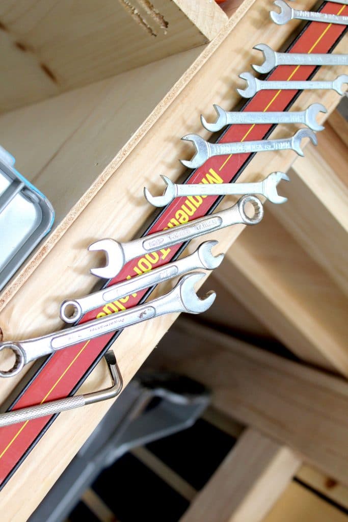 Using magnetic strips to organize garage tools